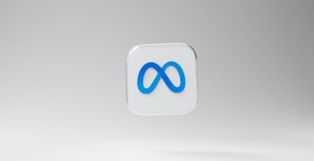 a white square with a blue logo on it